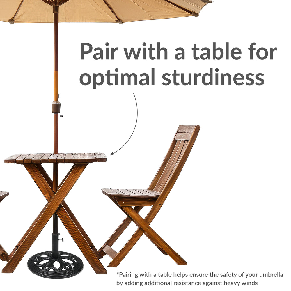Sunnydaze 18-Inch Round Cast Iron Patio Umbrella Base Black under table in use